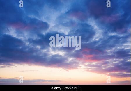 Beautiful evening sky with clouds at dusk . Sunset sky background. Stock Photo