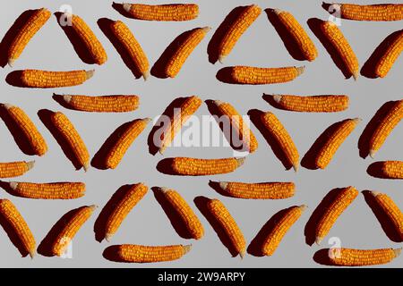 Corn cob seamless pattern. Isolated vegetable style wallpaper. . Minimalistic concept of vegetarianism. Stock Photo