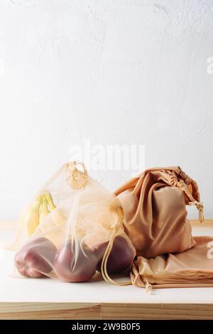 Fruits in reusable bags on the table. Zero waste concept. Stock Photo
