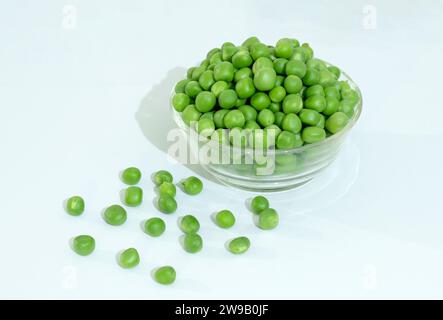 Green Peas - Matar Isolated on white Background. Green peas in Glass Bowl. Stock Photo