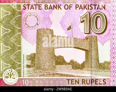 Fragment of Pakistani 10 Rupee banknote with Bab-e-Khyber (entrance to the Khyber Pass). Bab-e-Khyber is a monument situated at the entrance of the Kh Stock Photo