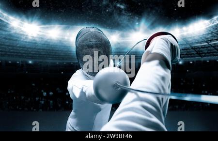 Portrait of two fencers against the backdrop of a sports arena. The concept of fencing. Duel. Mixed media Stock Photo