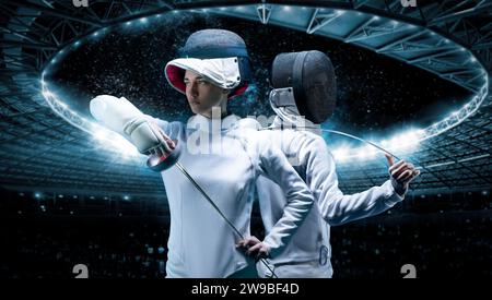 Portrait of two fencers against the backdrop of a sports arena. The concept of fencing. Duel. Mixed media Stock Photo