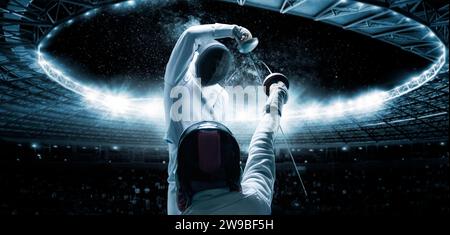 Portrait of two fencers against the backdrop of a sports arena. The concept of fencing. Duel. Mixed media Stock Photo