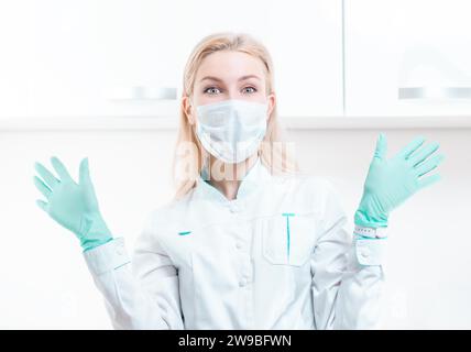 Portrait of a blonde girl in a mask. Coronavirus epidemic concept. Pandemic. Mixed media Stock Photo
