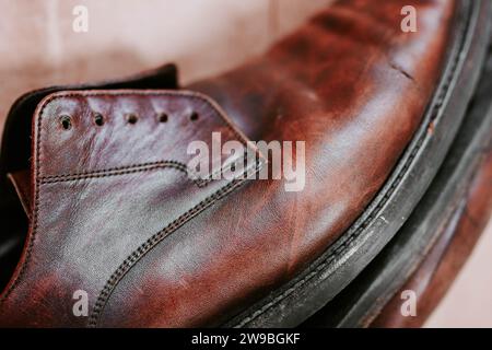 Brown men's shoes made of genuine leather close-up, shoe store Stock Photo