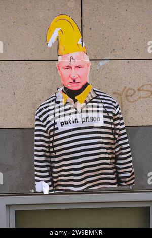 The performance artist Thomas Baumgärtel has immortalised Vladimir Putin on a protest poster. Putin is wearing convict clothing. Stock Photo