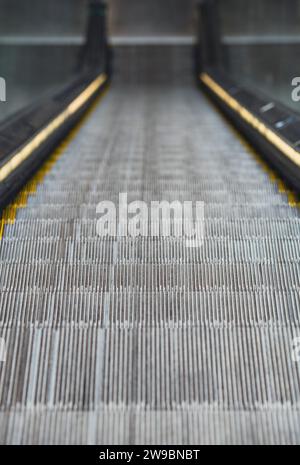 Looking down an empty escalator Stock Photo