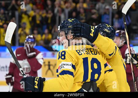 Gothenburg, Sweden. 26th Dec, 2023. Gothenburg, Sweden 20231226Score 2-0 Sweden's Filip Bystedt during the IIHF World Junior Championship group A ice hockey match between Sweden and Latvia at Scandinavium in Gothenburg, Sweden December 26, 2023. Foto: Björn Larsson Rosvall/TT/Kod 9200 Credit: TT News Agency/Alamy Live News Stock Photo