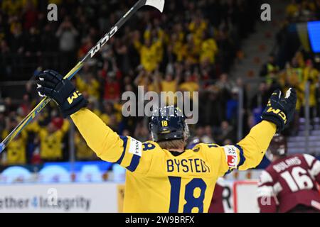 Gothenburg, Sweden. 26th Dec, 2023. Gothenburg, Sweden 20231226Score 2-0 Sweden's Filip Bystedt during the IIHF World Junior Championship group A ice hockey match between Sweden and Latvia at Scandinavium in Gothenburg, Sweden December 26, 2023. Foto: Björn Larsson Rosvall/TT/Kod 9200 Credit: TT News Agency/Alamy Live News Stock Photo