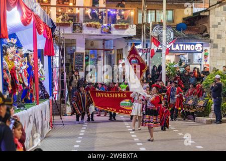 A ceremony procession in Aguas Calientes, Peru, celebrating the anniversary of Machu Picchu being declared a wonder of the world Stock Photo