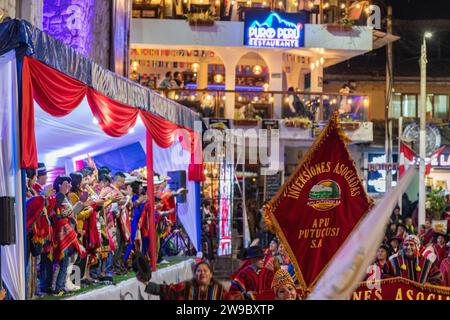 A ceremony procession in Aguas Calientes, Peru, celebrating the anniversary of Machu Picchu being declared a wonder of the world Stock Photo