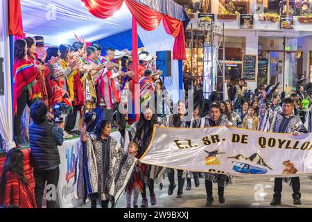 A ceremony procession in Aguas Calientes, Peru, celebrating the anniversary of Machu Picchu being declared a wonder of the world Stock Photo