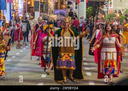 A ceremony procession in Aguas Calientes, Peru, celebrating the anniversary of Machu Picchu being declared a wonder of the world Stock Photo