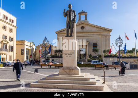 Statue of former Prime Minister Ġorġ Borg Olivier in front of the Stock Exchange building on Castille Square in Valletta, Malta Stock Photo