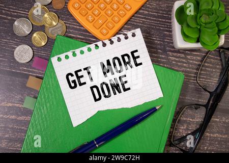 Get More Done Text written on notebook page, red pencil on the right. Motivational Concept image Stock Photo