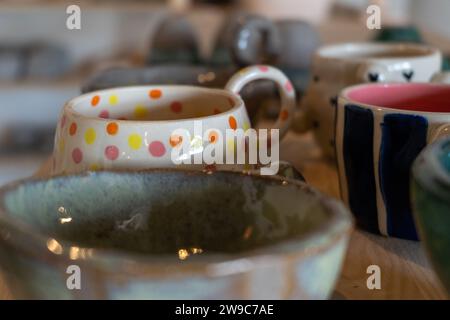 Lots of handmade pots on a wooden shelf. High quality photo Stock Photo