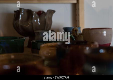 Lots of handmade pots on a wooden shelf. High quality photo Stock Photo