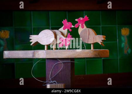 Pecking chickens handmade wooden toy Stock Photo