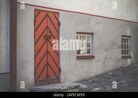 Vintage wooden door. Empty street and old building facade Stock Photo