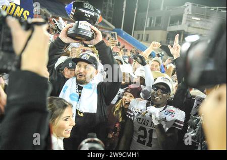 December 26, 2023: Texas State Bobcats head coach GJ Kinne holding the championship trophy Servpro First Responder Bowl game between the Texas State University Bobcats and the Rice University Owls at Gerald J. Ford Stadium, Dallas, TX. Bobcats wins against the Owls, 45-21. Patrick Green/CSM Stock Photo