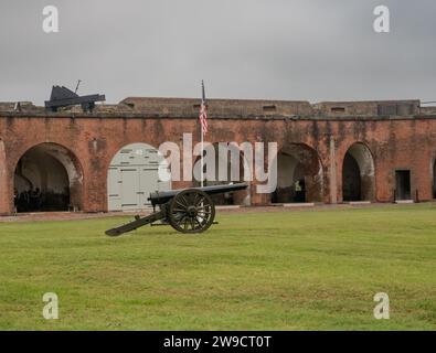 Fort Pulaski National Historic Monument near Savannah, Georgia, with a perimeter of defensive buildings and a cannon in the courtyard. Photographed on Stock Photo