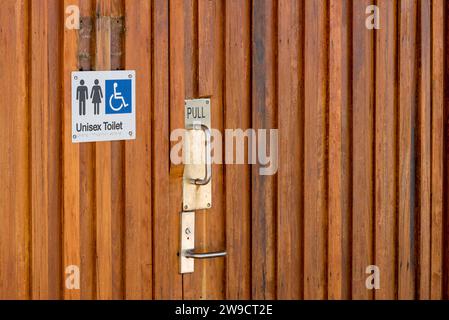 Timber paneled doors on the unisex Choi Ropiha Fighera (CHROFI) Architects designed public amenities at Port Botany, Sydney Stock Photo