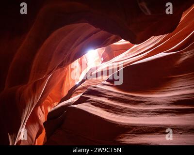 Orange and rust colored striated Navajo Sandstone walls in Upper Antelope Canyon near Page, Arizona. Stock Photo