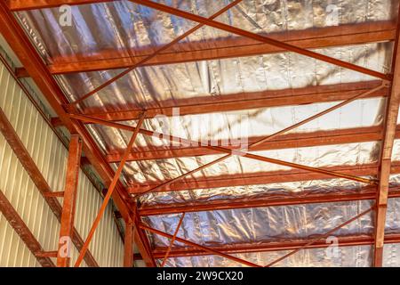 roof insulation indoors industrial warehouse with corrugated metal sheet and aluminum foil Stock Photo