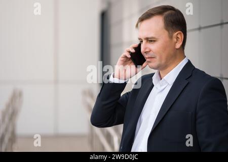 Adult man office worker discusses business matters with boss Stock Photo