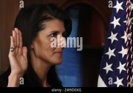 Washington, United States. 27th Dec, 2023. File photo dated January 25, 2017 shows Nikki Haley raises her right hand while being sworn in as the U.S. Ambassador to the United Nations in Washington, DC, USA. The former South Carolina governor Nikki Haley has pulled within four percentage points of frontrunner Donald Trump in New Hampshire's 2024 Republican presidential primary, a contest which could prove closer than expected for the ex-president, according to a new poll. Photo by Win McNamee/Pool/ABACAPRESS.COM Credit: Abaca Press/Alamy Live News Stock Photo