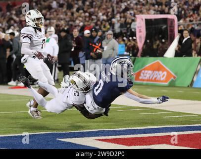 Dallas, Texas, USA. 26th Dec, 2023. Rice University running back DEAN CONNORS (0) stretches out for the end zone as Texas State's SHAWN HOLTON (23) holds on in an attempt to keep Connors out of the end zone. In the background following Holton is teammate CHRIS MILLS (7). Texas State and Rice University played in the First Responders Bowl at Gerald J. Ford Stadium on the SMU campus on Tuesday. Texas State defeated Rice 45-21. (Credit Image: © Brian McLean/ZUMA Press Wire) EDITORIAL USAGE ONLY! Not for Commercial USAGE! Stock Photo