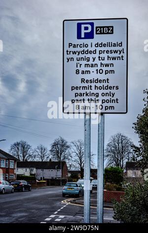 Car Parking restrictions sign in English and Welsh, Road Safety. Traffic control. Car park zone. Enforcement. Urban. Suburban. Resident.Concept. Legal. Stock Photo