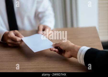 Executive sending resignation letter to male employee for cancel contract and layoff job. Stock Photo