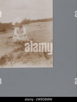 Portrait of an unknown girl in the sand, Johannes Diderik van der Waals (1873-1971) (Attributed to), 1900 - 1920 photograph   photographic support  historical persons - BB - woman. sand (soil type) Stock Photo