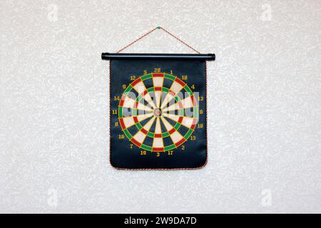 Dartboard on wall. Magnetic darts for children. Copy space. Space for text Stock Photo