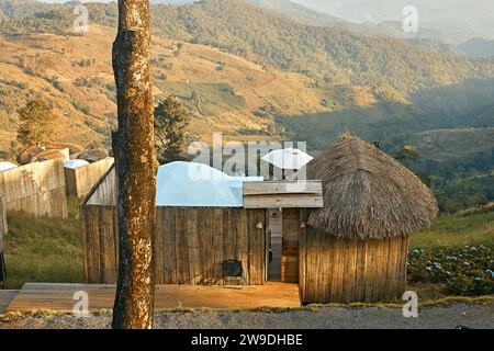 Homestay in the Doi Chang mountains of Chiang Rai Northern Thailand, bamboo wooden hut in the mountains, cottage cabin at sunset in the mountains of N Stock Photo