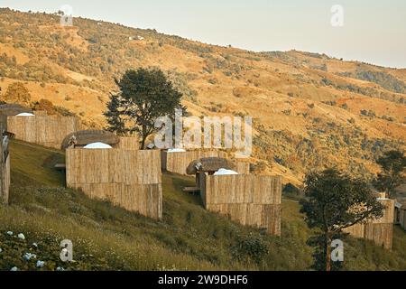 Homestay in the Doi Chang mountains of Chiang Rai Northern Thailand, bamboo wooden hut in the mountains, cottage cabin at sunset in the mountains of N Stock Photo