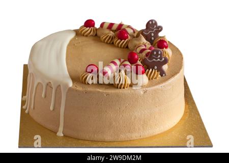 Hand finished Christmas Caramel Cake from M&S isolated on white background Stock Photo