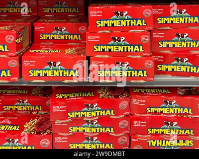 Italy - Dec. 24, 2023: Simmenthal canned meat packages displayed on shelf for sale in italian supermarket Stock Photo