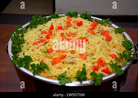 Sri Lankan delicious spicy noodles with egg,carrots, leeks and bell peppers in buffet Stock Photo