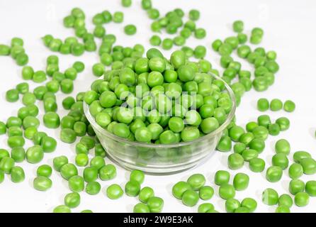 Green Peas - Matar on white Background. Green peas in Glass Bowl. Stock Photo