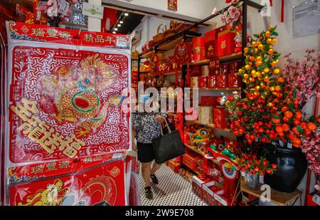 Kuala Lumpur, Malaysia. 27th Dec, 2023. An ethnic Chinese woman shops for home decorations ahead of the Lunar New Year of the Dragon, more specifically, Wood Dragon, starting from February 10th, 2024, which will be celebrated by the Chinese around the world. (Credit Image: © Wong Fok Loy/SOPA Images via ZUMA Press Wire) EDITORIAL USAGE ONLY! Not for Commercial USAGE! Stock Photo