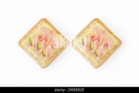 Two creme crackers topped with cheese and ham Stock Photo