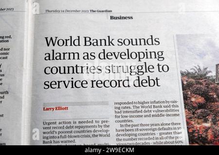 'World Bank sounds alarm as developing countries struggle to service record debt' Guardian newspaper headline 14 December 2023 London England UK Stock Photo
