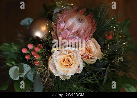 Close-up of a beautiful Christmas bouquet against a dark brown background, view from above Stock Photo