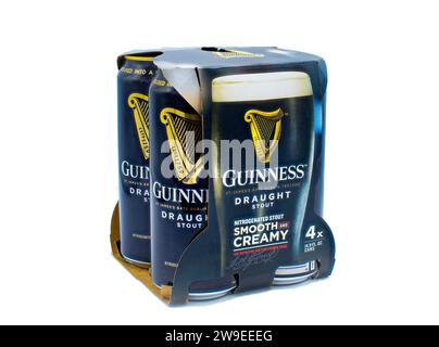 12-22-2023 Ocala, Florida Guinness draught stout beer in four pack can with gold color harp logo in cardboard retail packaging. product of Dublin, Ire Stock Photo