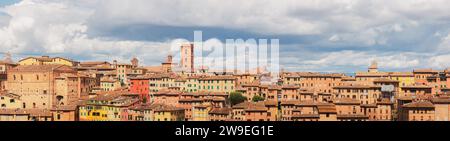 Wide panoramic view of colourful and scenic townscape of historic hilltop village Siena, Tuscany, Italy. Stock Photo