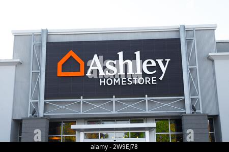 OCALA, FL USA November 22, 2023 Ashley Homestore American store chain that sells furniture products. outside exterior of building entrance with orange Stock Photo