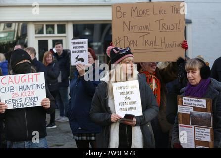 Bungay, UK. 26th Dec, 2023. Protesters hold placards criticising the hunt and the hunt supporters during the demonstration. Action Against Animal Cruelty, protest was held in the town centre, Bungay as the Waveney and Norfolk Harriers parade through the streets supporting the countryfolk. The protesters said that despite their being a ban on traditional fox hunting, animals are still being killed during the trail hunting alternative and they are calling for a total ban. (Photo by Martin Pope/SOPA Images/Sipa USA) Credit: Sipa USA/Alamy Live News Stock Photo